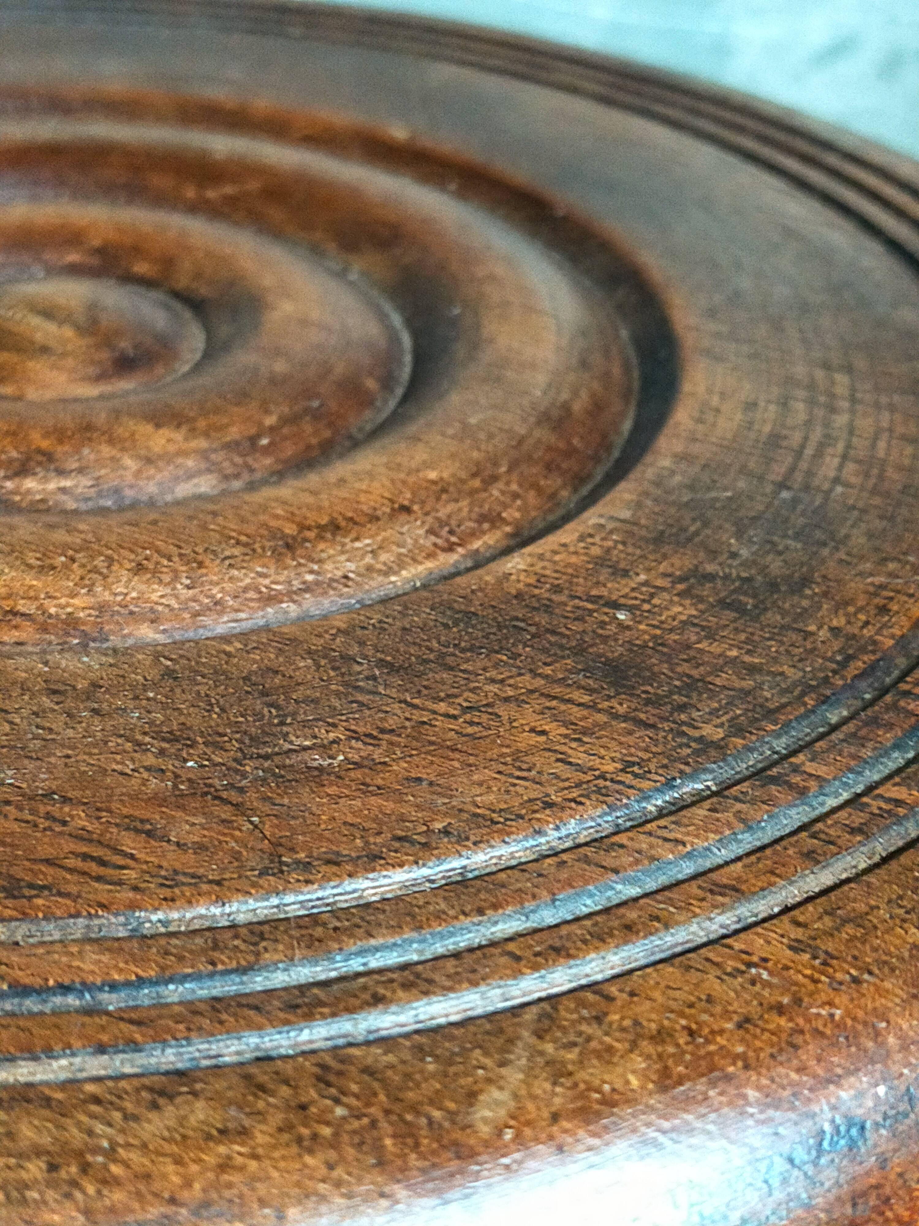 Low tripod stool in vintage turned solid wood