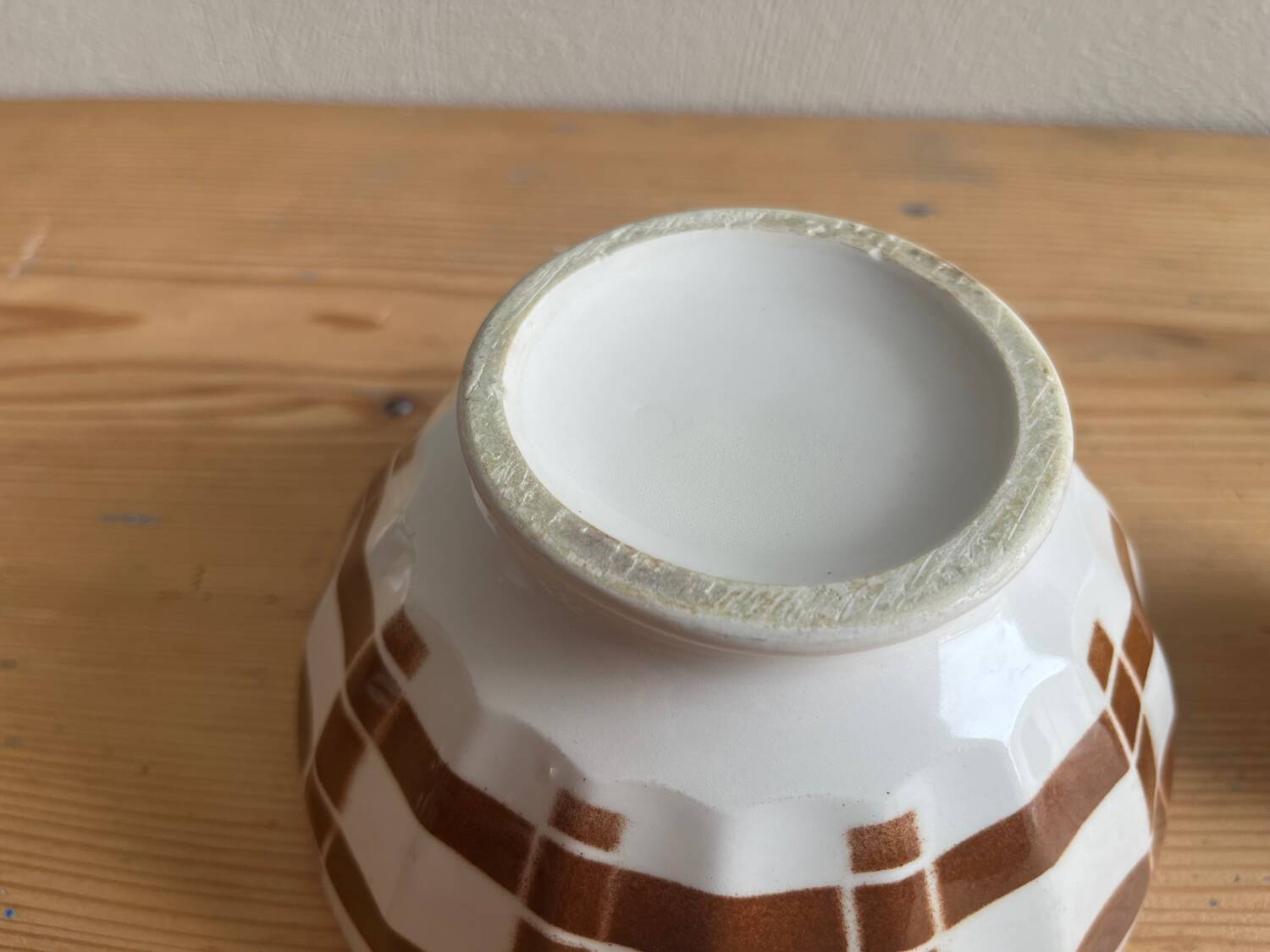 Antique faceted bowl on earthenware pedestal