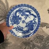 Asian porcelain plates decorated with blue dragons