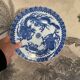 Asian porcelain plates decorated with blue dragons