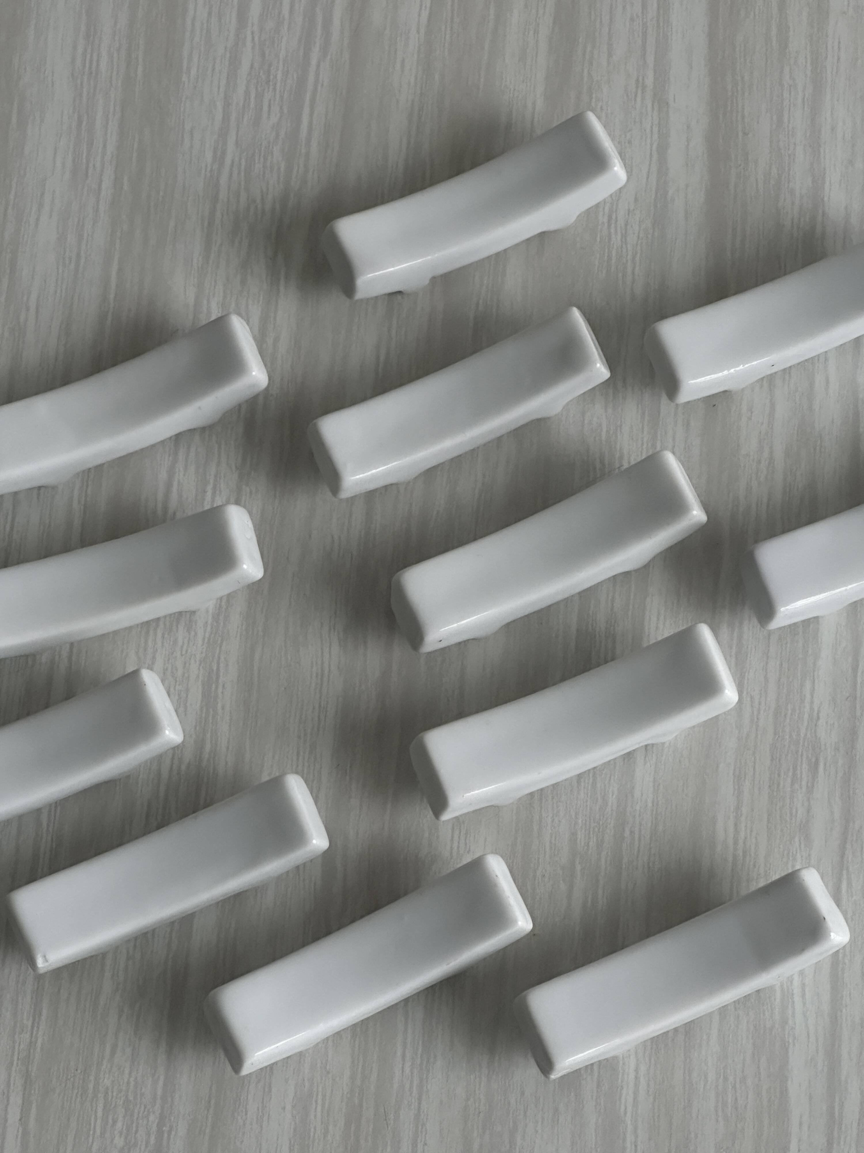 Set of white porcelain chopstick holders