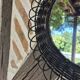 Vintage black rattan flower mirror