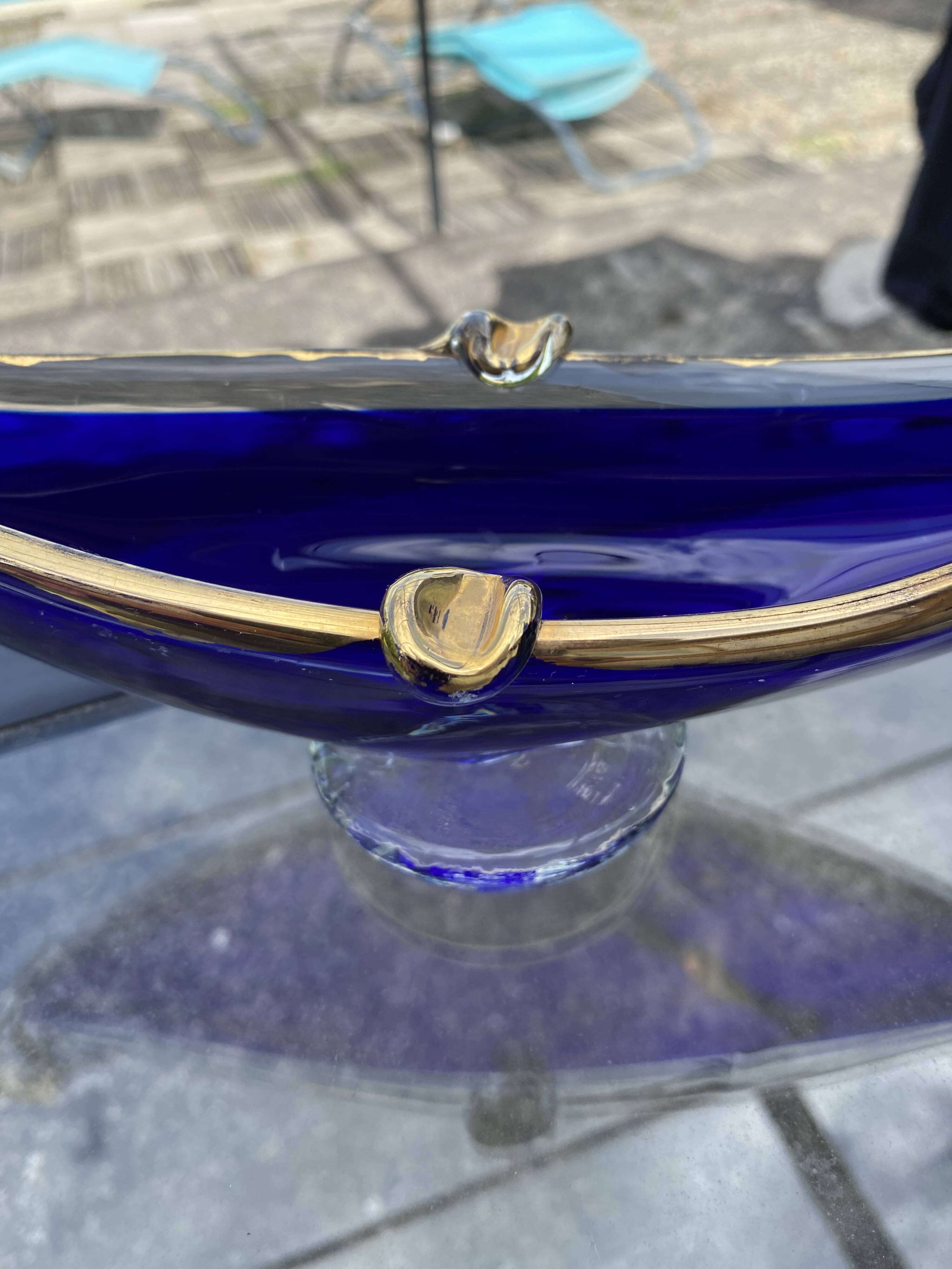 Vintage cobalt blue Murano glass gondola bowl with gilding.
