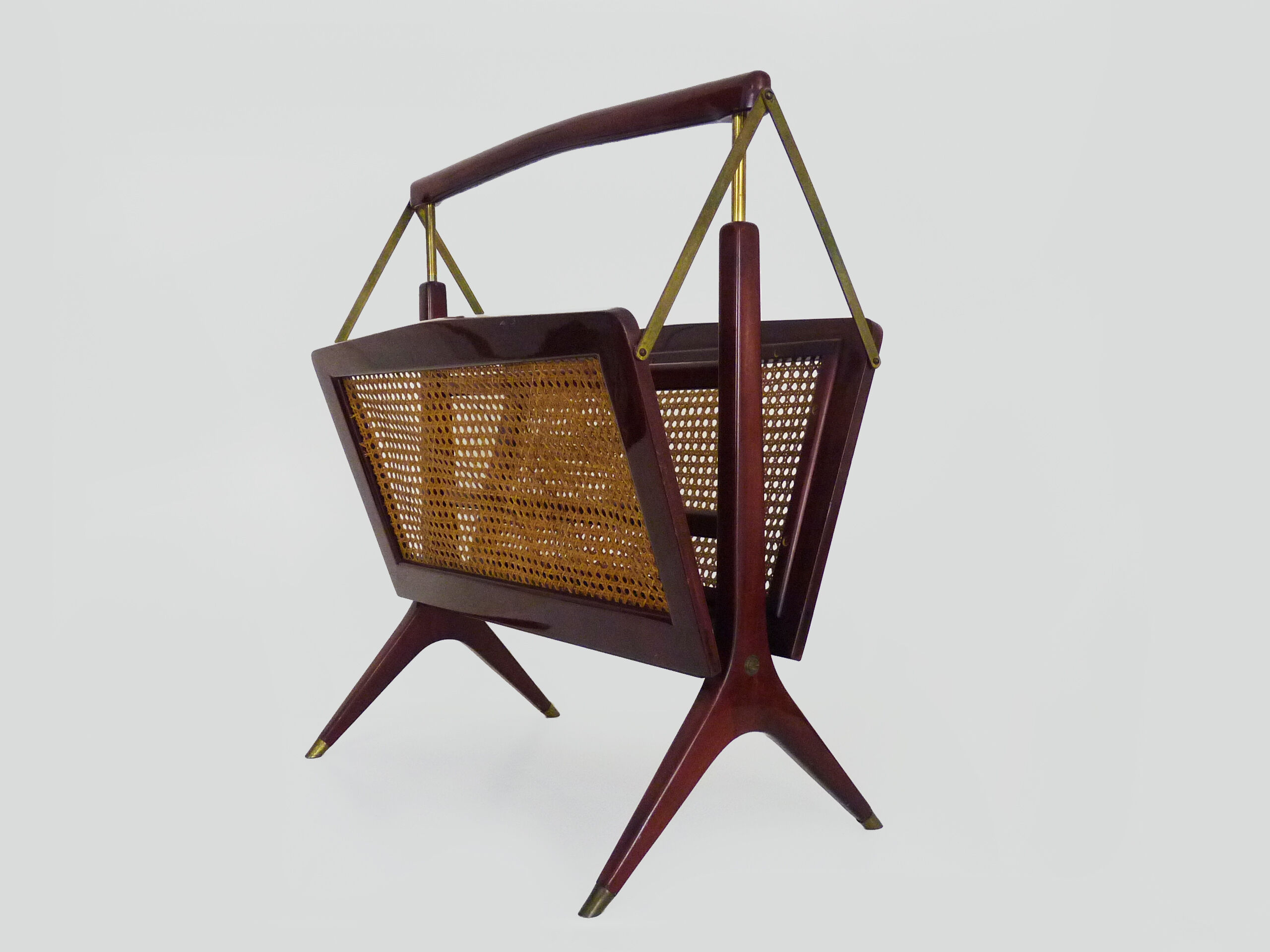 Magazine holders, italy, 1950s. walnut, canage, brass