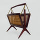 Magazine holders, italy, 1950s. walnut, canage, brass
