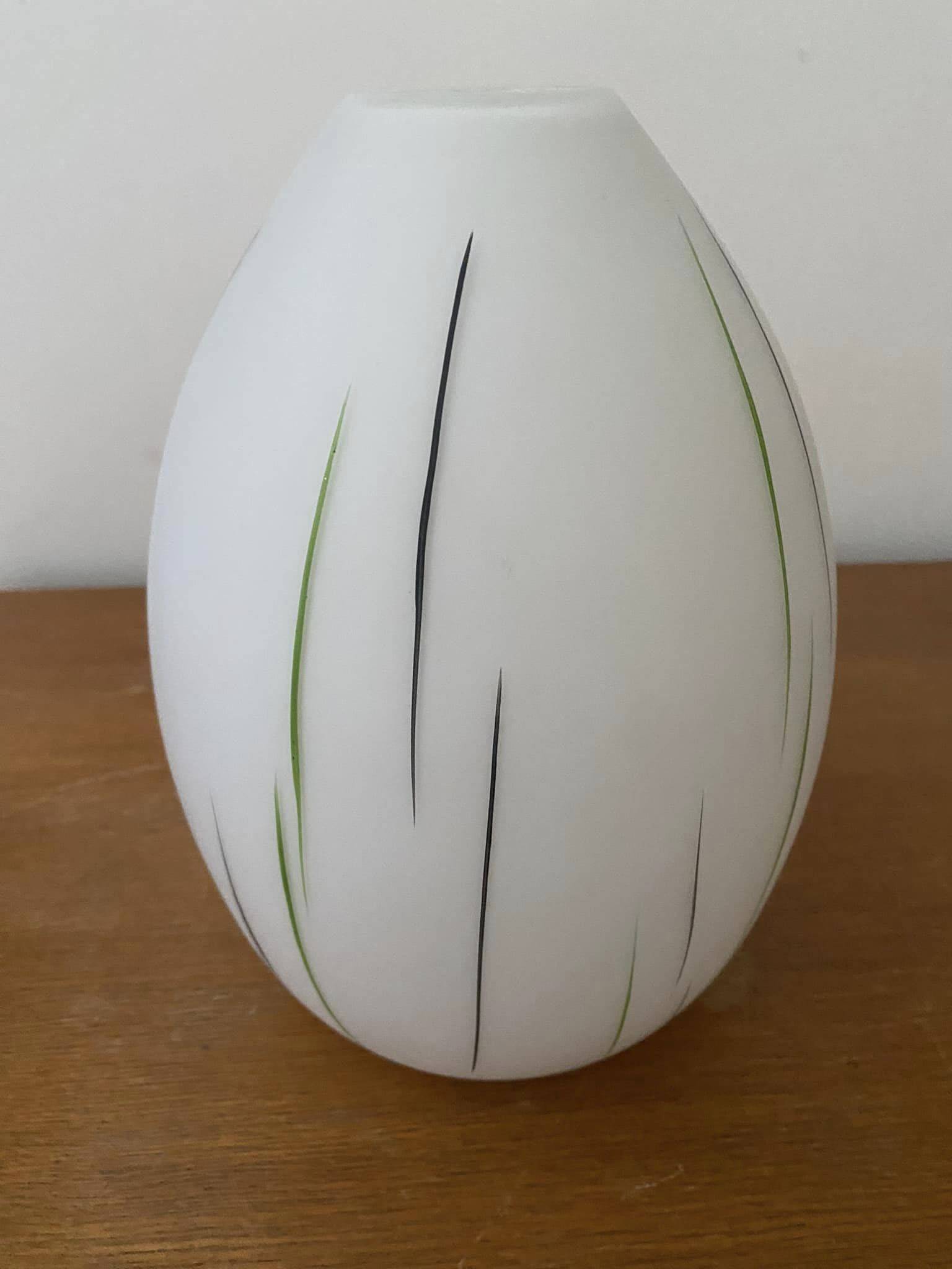 White opaline tulip with dark green and gray streaks. Oblong shape.