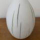 White opaline tulip with dark green and gray streaks. Oblong shape.