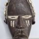 Tribal Dan mask in wood and cowrie shells, West Africa, 27 cm