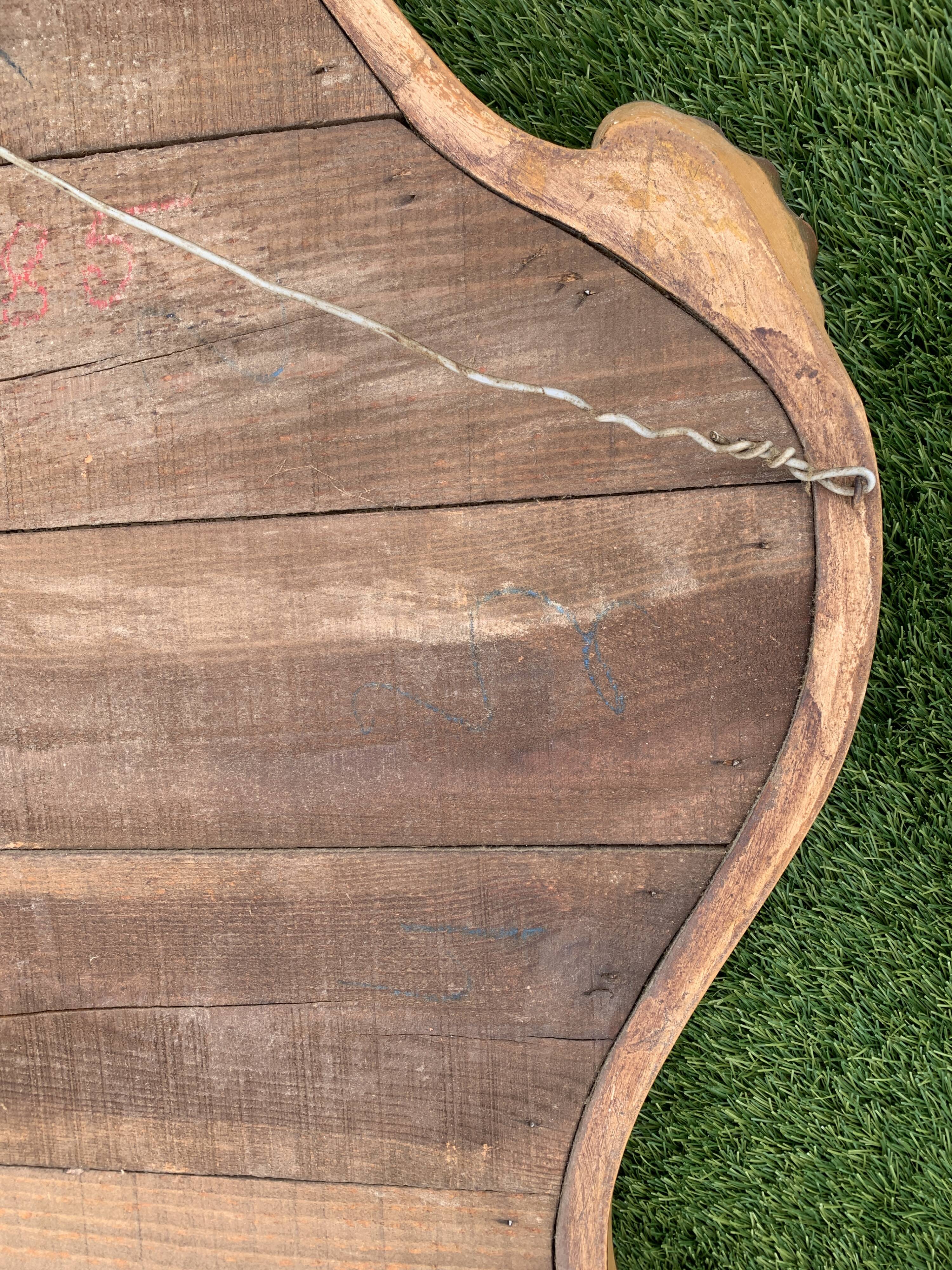 Old mirror in carved wood and gilded leaf, Louis XV rocaille style, twentieth century 59x87cm