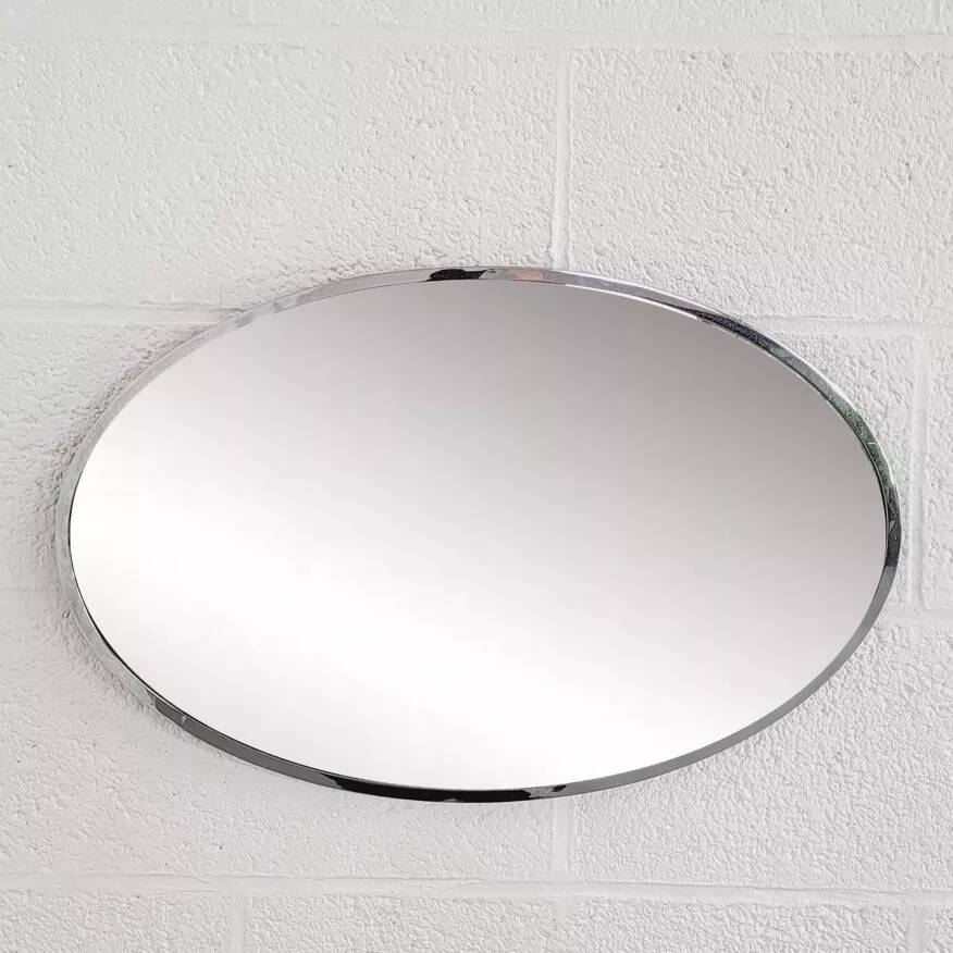 Oval mirror from the 1960s with a chrome frame.