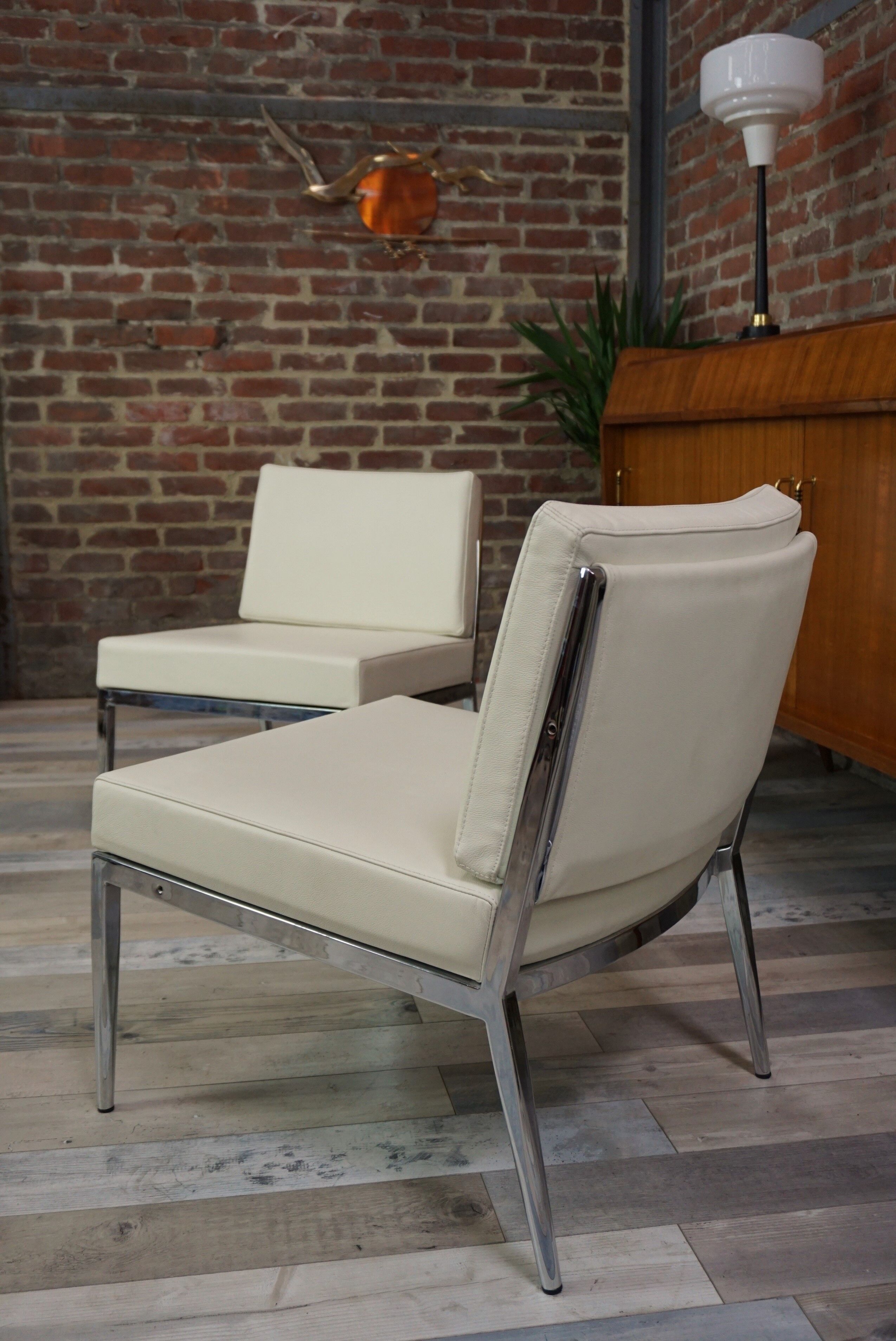 Pair of chrome and leather armchairs