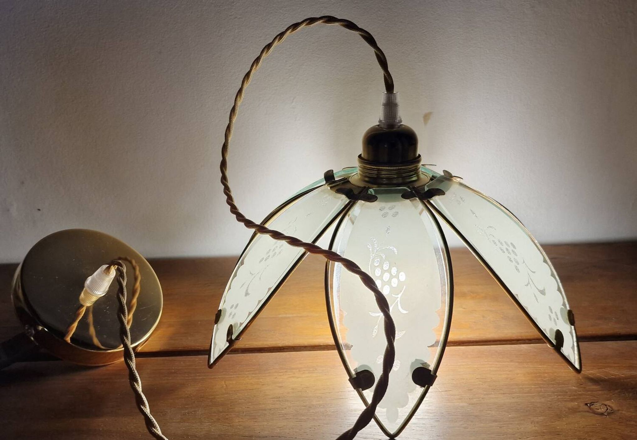 Glass flower rimmed with brass