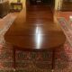 Extensible Louis XVI dining table in period Directoire mahogany.