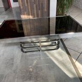 Coffee table with chrome base and mirrored glass top, vintage solar flare decor