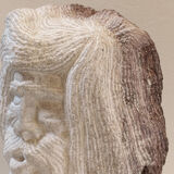 Carved stone head sculpture