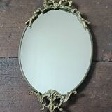 Antique mirror, oval with brass crest