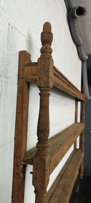 Old oak shelf back of glass counter wall