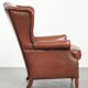 Cognac-coloured cow leather wingback armchair in English style