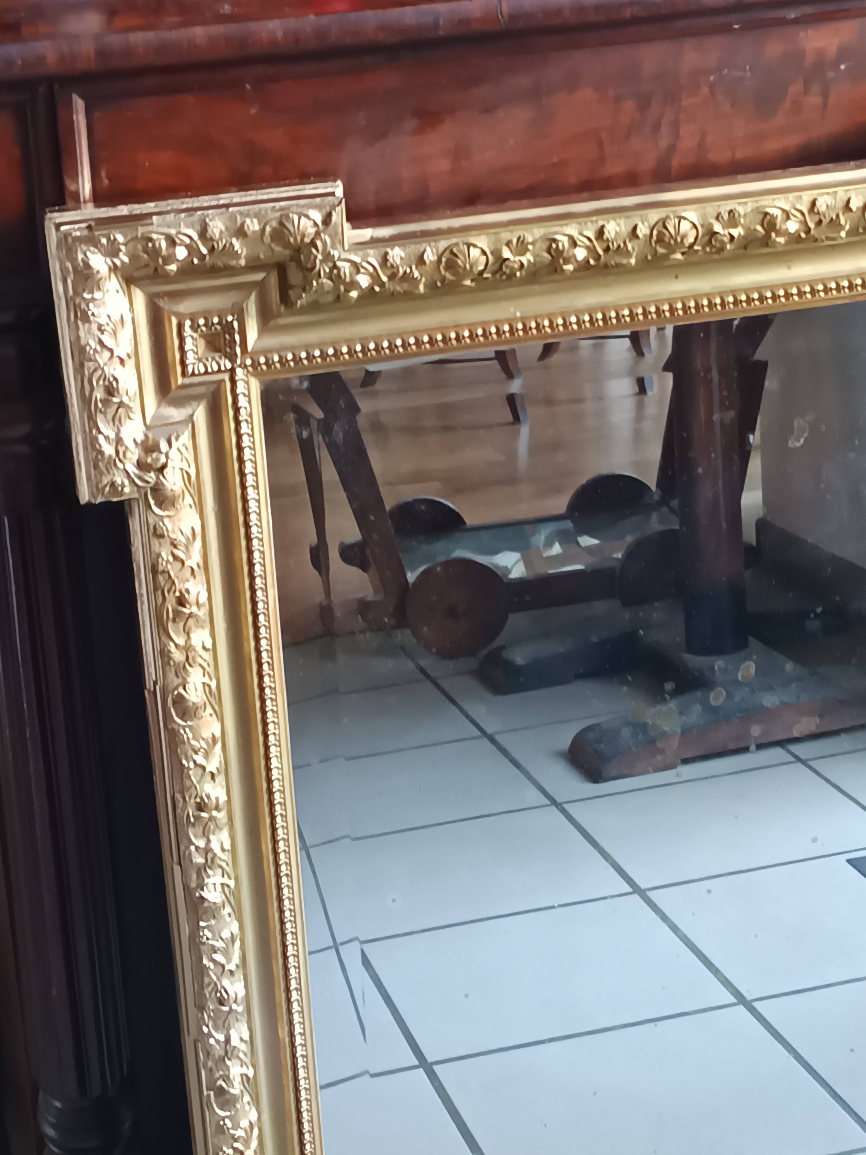 Antique mirror in wood and gilded stucco, neo Louis XVI style.