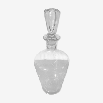 Glass alcohol wine decanter with engraved drawings and stopper