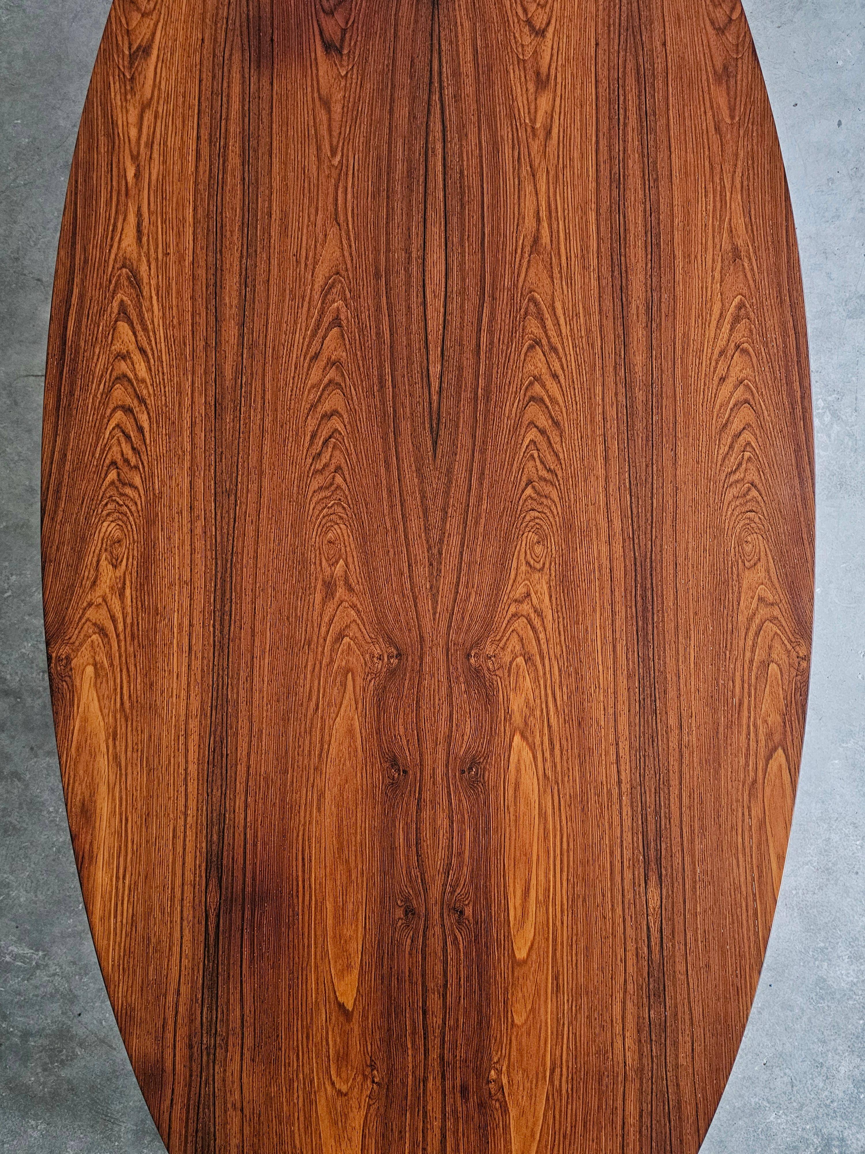 Danish Mid Century Modern oval coffee table with a teak top and chrome legs.