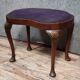 English piano stool in Louis XV style made of mahogany in a bean shape.