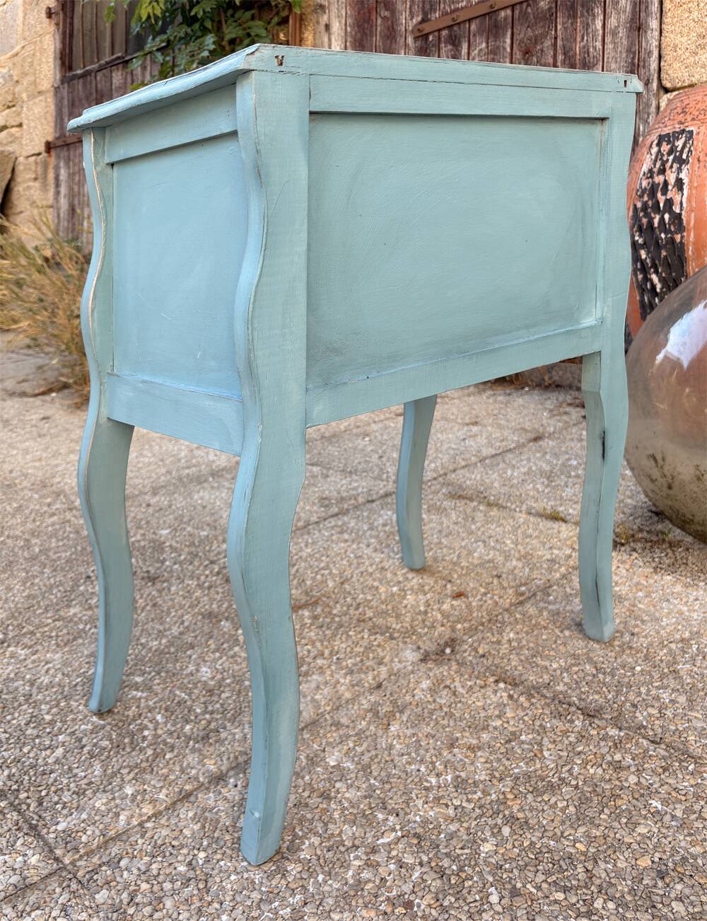 Pair of patinated lagoon blue bedside tables, early 20th century, with curved legs.