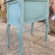 Pair of patinated lagoon blue bedside tables, early 20th century, with curved legs.