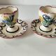 Pair of HB Quimper egg cups with integrated pedestal base, floral decoration