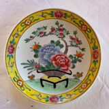 Yellow porcelain plate with saturated and vivid colors. Handmade in Japan