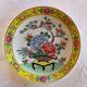 Yellow porcelain plate with saturated and vivid colors. Handmade in Japan