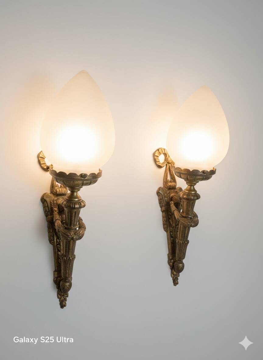 Pair of torch wall lights in Louis XVI style in 19th-century bronze.