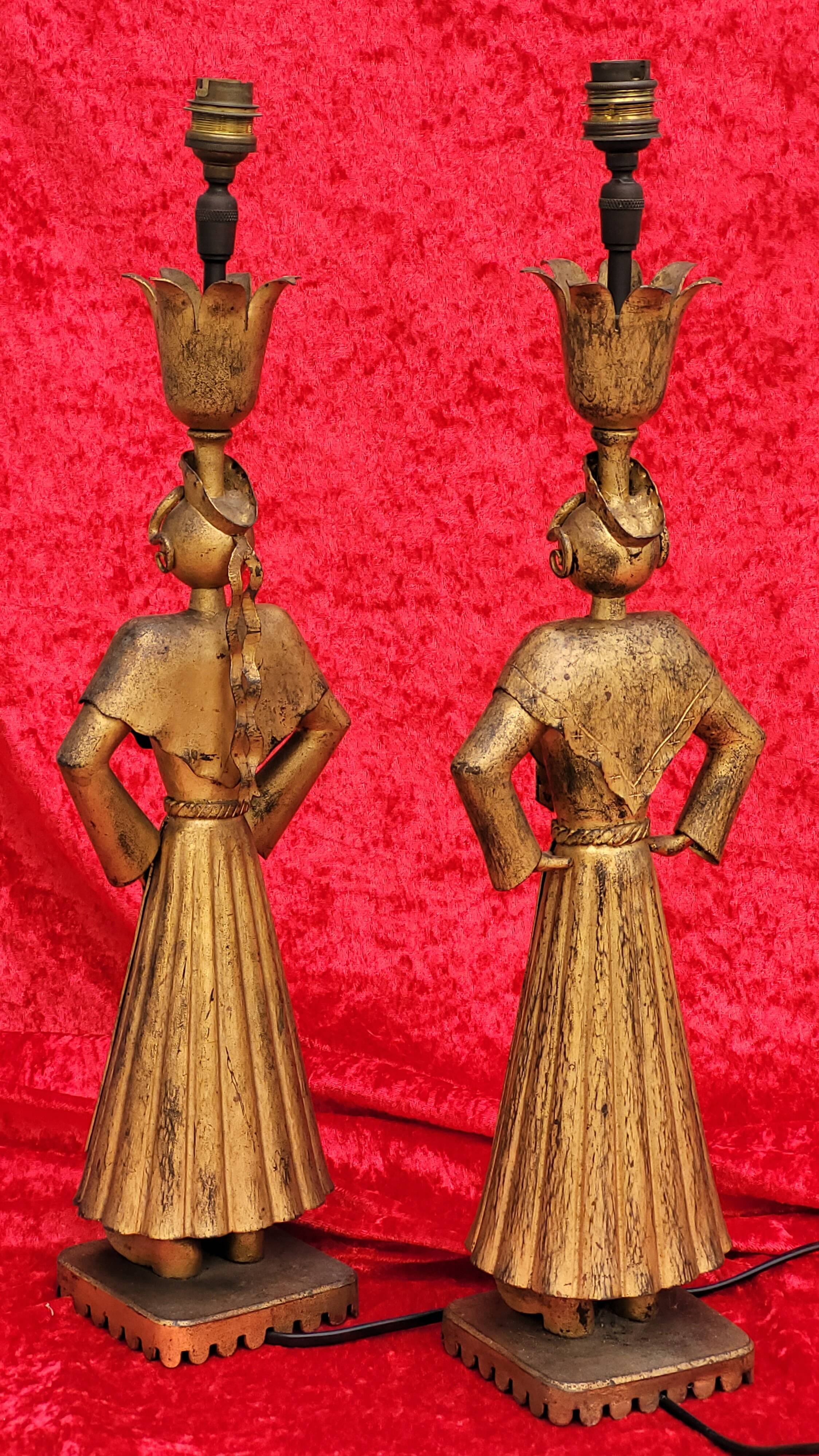 Pair of gilded beaten iron sculpture lamps attributed to Gilbert Poillerat