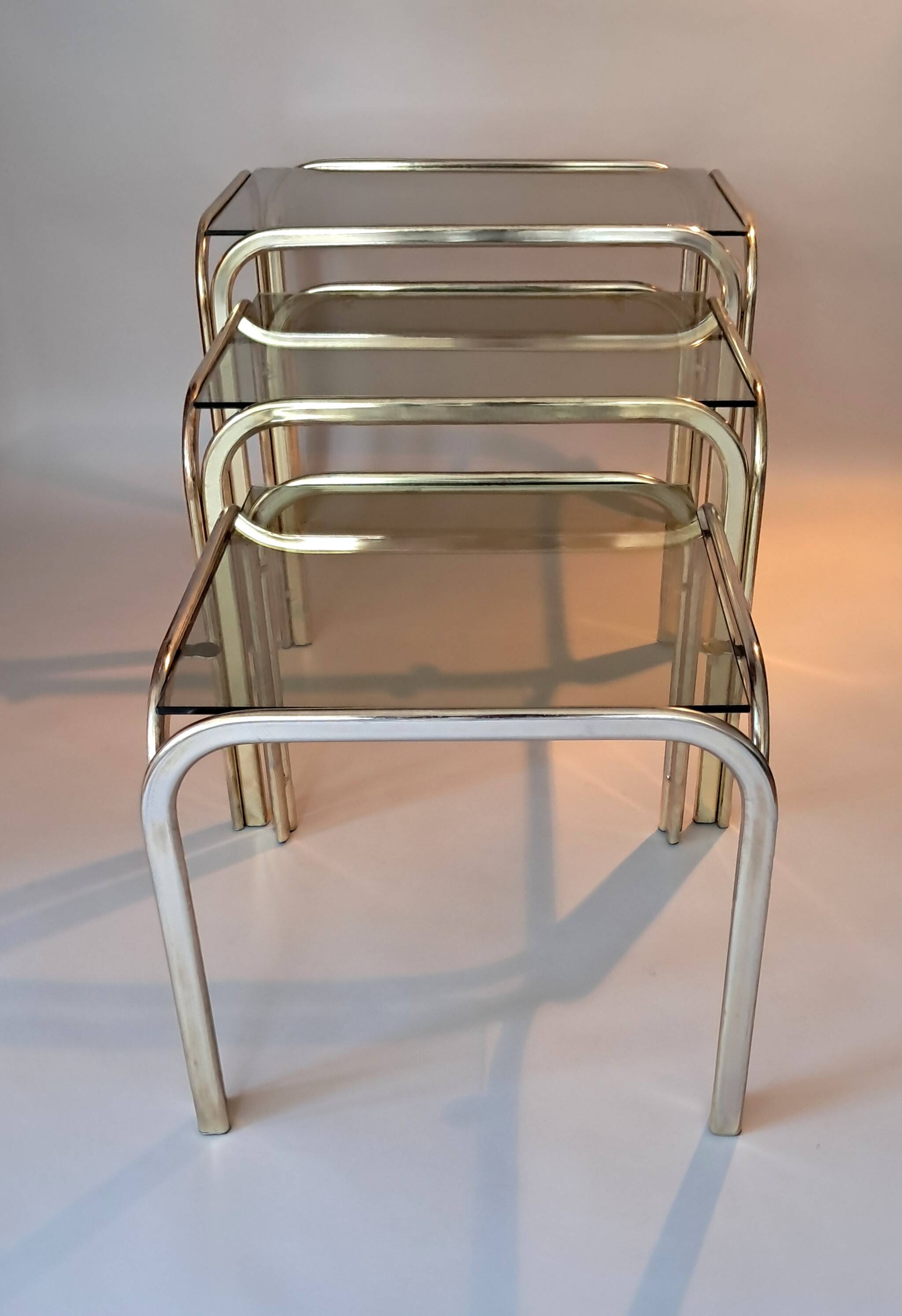 3 vintage golden nesting tables with smoked glass.