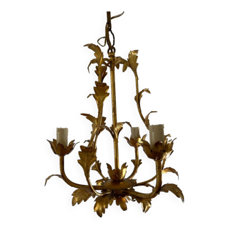 Golden metal chandelier with leaf decor