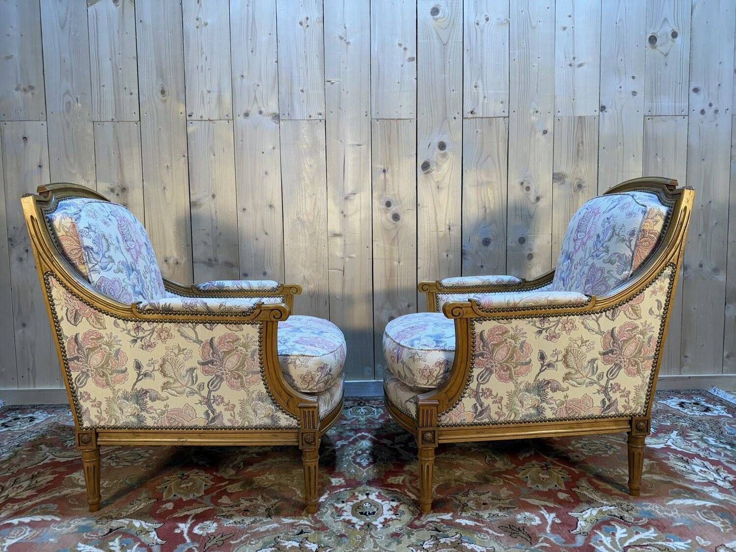 Pair of armchairs / bergères and footstool in Louis XVI style
