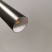 Two cylinder-shaped hanging lamps in black lacquer