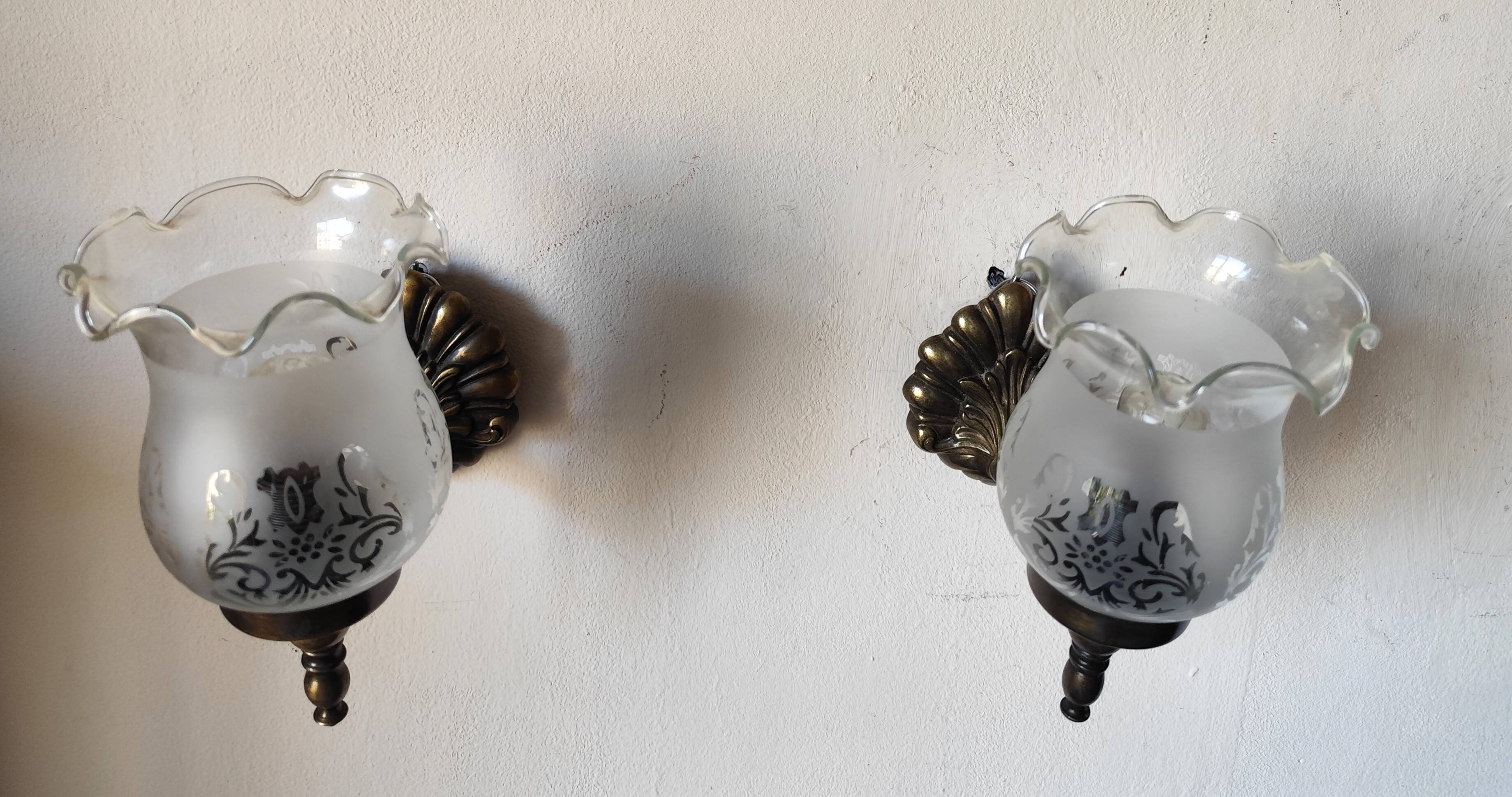 Pair of wall sconces in bronze with opaline glass tulips.