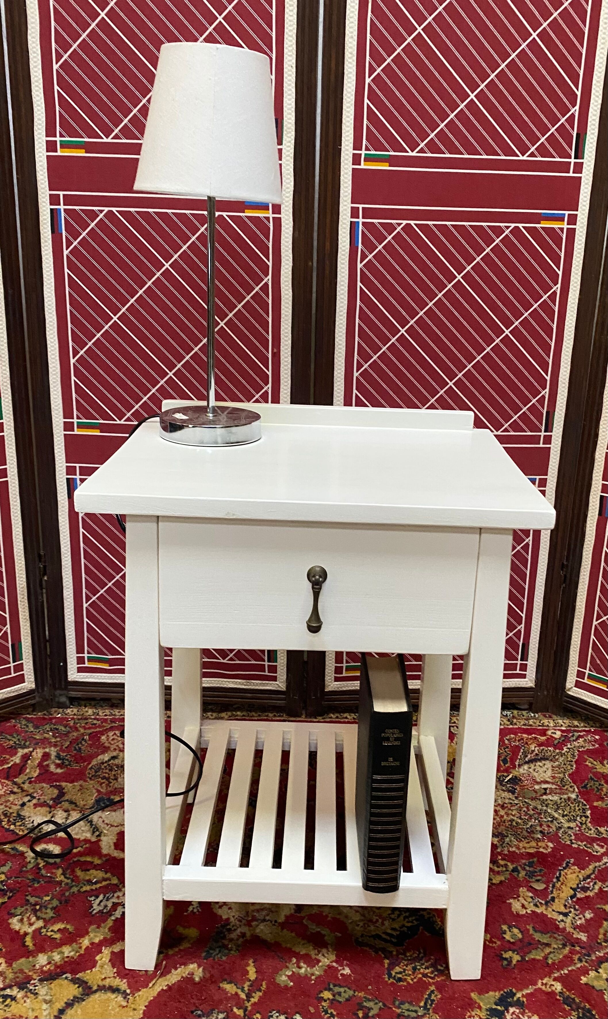 Wooden bedside table painted white