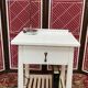 Wooden bedside table painted white
