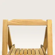 Blonde wooden folding chair in the style of Aldo Jacober.