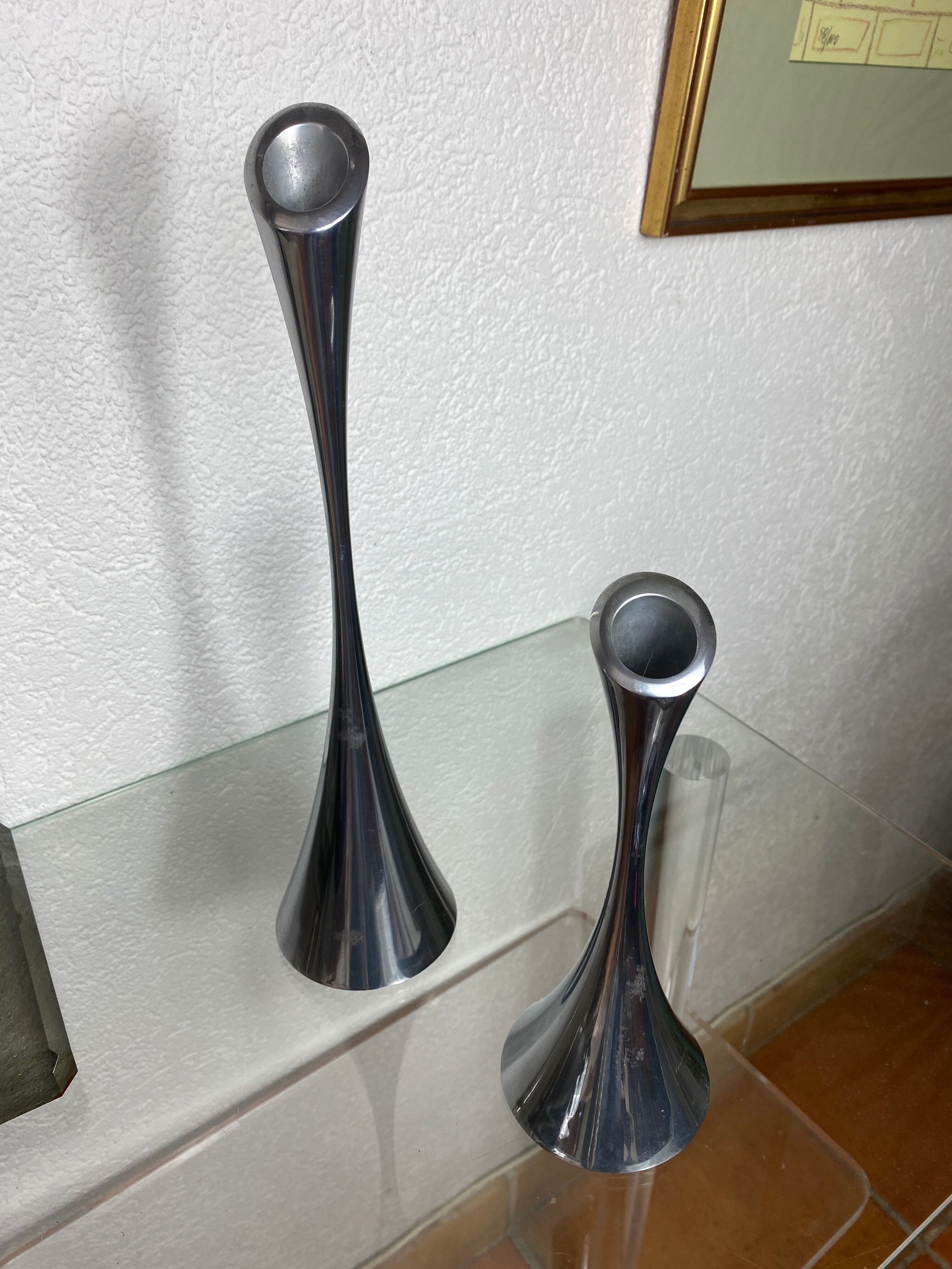 Pair of designer candle holders in stainless steel