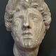 Antique plaster sculpture of a female face from the early 20th century