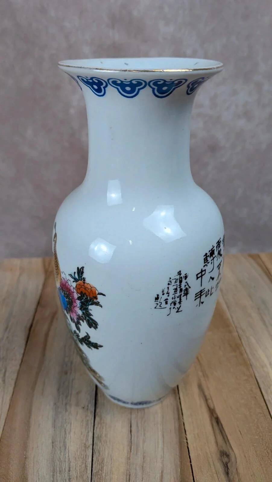 Asian vase decorated with peacock in porcelain