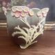Antique cache-pot from the 1900s in majolica with a raised floral decoration in pink, very decorative.
