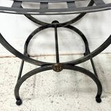 Set of four wrought iron chairs, with a reclining X-shaped base, seat and backrest.