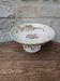 Flat serving compote dish in Terre de Fer HB & Cie with brown floral decoration.
