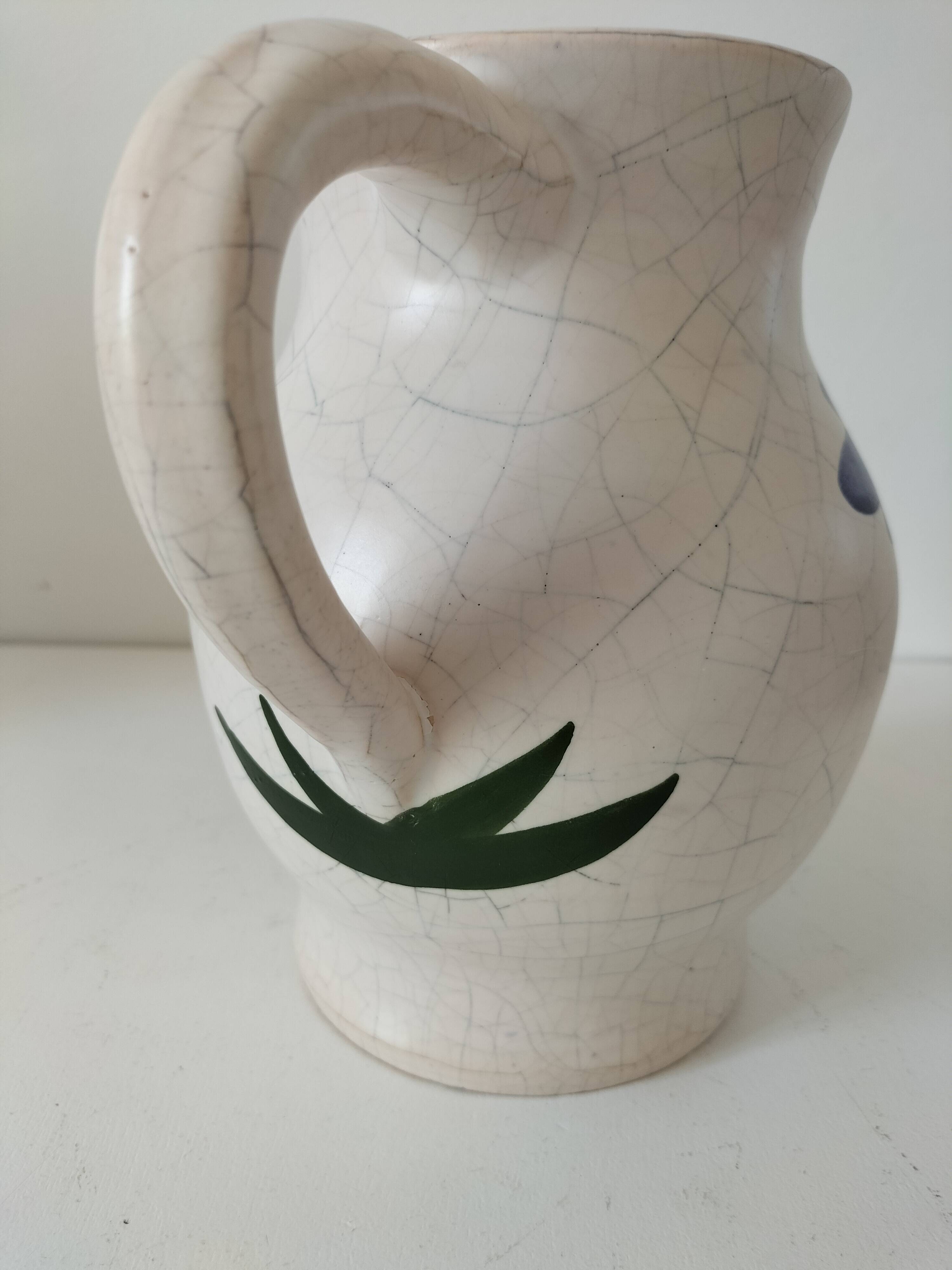 Vintage pitcher with floral decoration in the style of Poterie du Marais