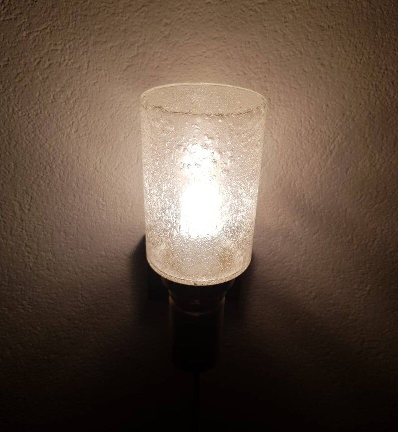 Brass applique with 1970 glass lampshade