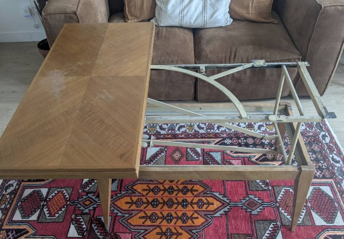 Lift-top coffee table that converts into a dining table.